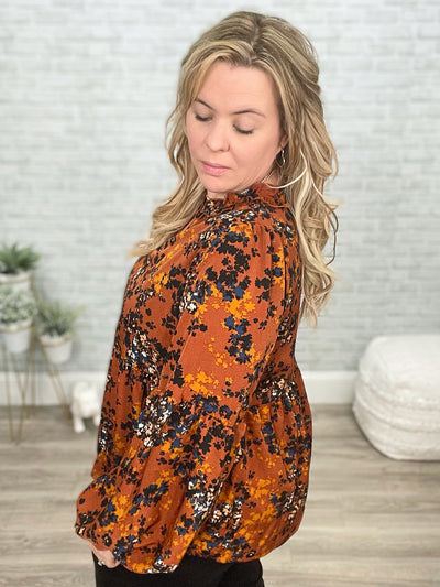 Sense Of Belonging Floral Babydoll Blouse In Rust